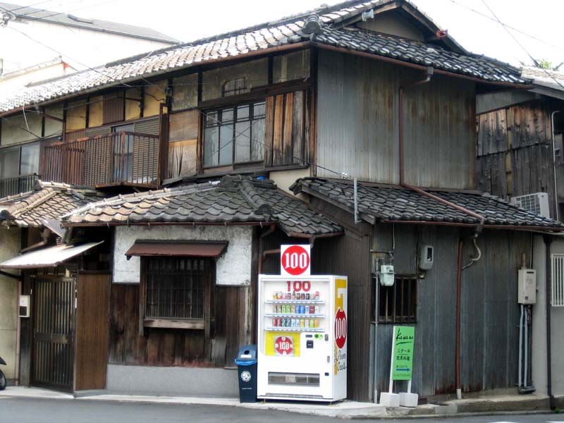 This picture is Kyoto in a nutshell. The old and the new sharing a space too small for them to coexist without sometimes intruding on each other's turf.