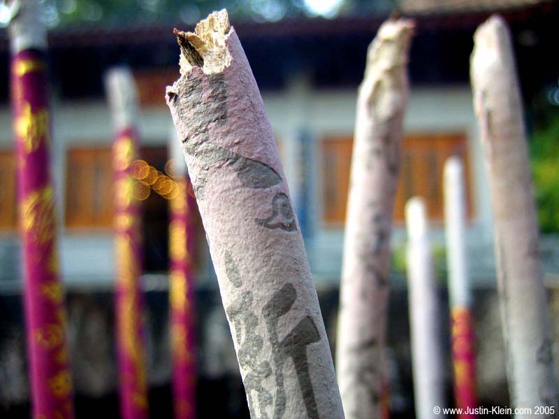 The ash left over by burnt incense with the kanji still visible