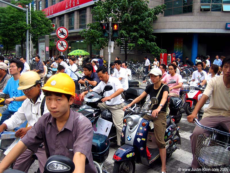 Armies of bicycles and scooters populate virtually every street of Shanghai during the daylight hours