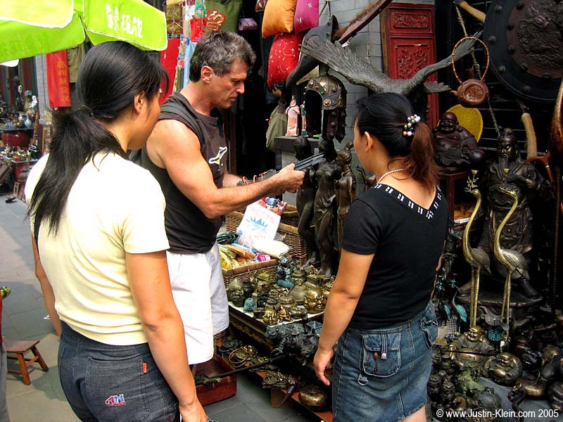 My dad bargaining for some arrows at the flea market.