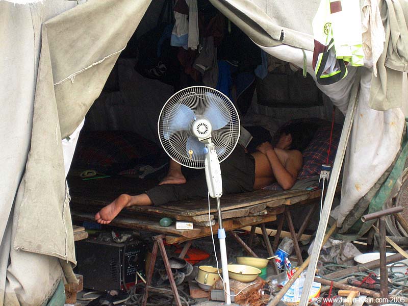 A man asleep in what appeared to be his house (in a small back-alley of Beijing)