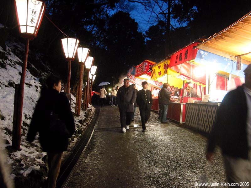 A row of food booths at a festival last winter in Kyoto, not dissimilar (at a glance) to the night market in Beijing. 