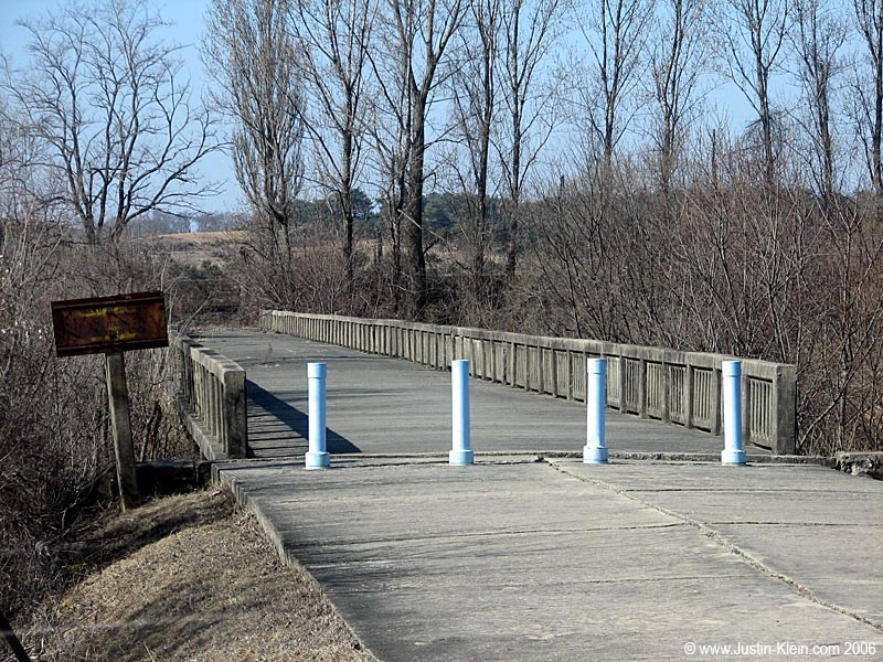 Remember that scene in the Bond movie "Die Another Day" where a prisoner is being exchanged between North and South Korea over the "bridge of no return?"  Well, that was a Hollywood replica.  Here's the real thing. 