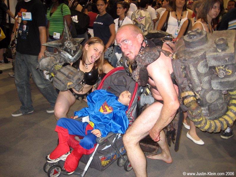 A cosplay family. I'm not sure what the parents were supposed to be, but I predict that this child might just have some issues to resolve when he gets older. Like, why his father chose to roam about in public wearing a G-string with a styrofoam bolt covering his privatest of privates.
