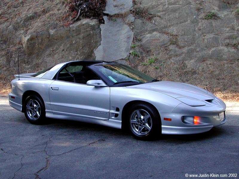 A happy Justin comes home with a new car. 