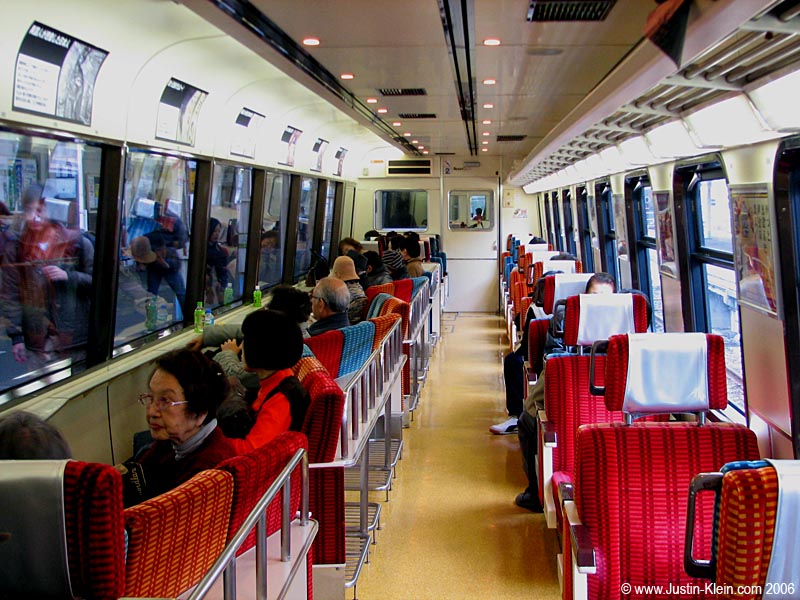 Inside the Black Ship Train, with the seaside seats rotated to provide magnificent views of Izu-Hanto's volcanic coastline. 