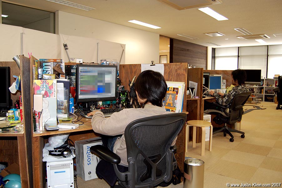 A couple coworks hard at work makin' some games. Sorry for censoring the screen - game company security can be even tighter than the US Department of Defense at times! 
