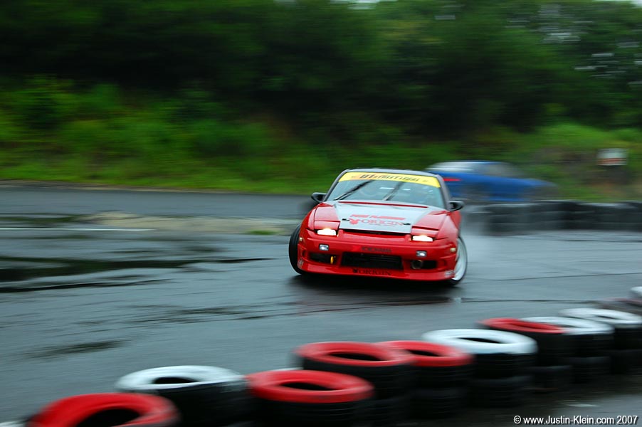All of the photos here were taken in the rain, but the above description refers to a later race during which the rain stopped for a few hours and the track dried off...mostly.