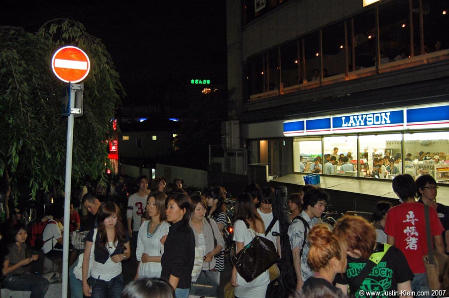 Outside Lawson convenience store on a Saturday night. 