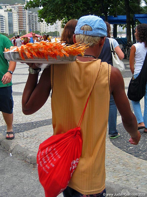 An interesting-looking guy heading to the sands of Ipanema for a bit of shrimp-selling.