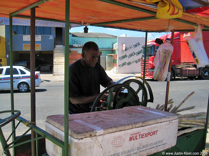 A REALLY friendly street vendor making us some fresh sugar cane juice...by cramming recently cut stalks into this gas powered chomper-device. Clean and insect-free, I'm sure!