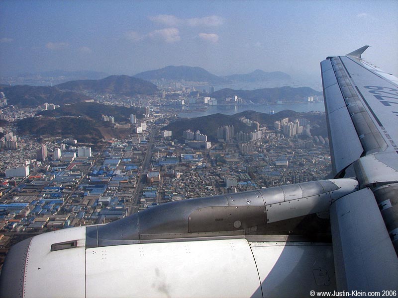 This photo is a LIE. It was taken over Busan, South Korea one year earlier. It was just the first airline photo I found while working on this post : P
