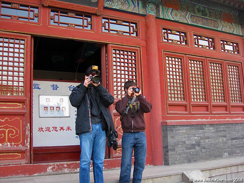 6'2" Andy and his massive Canon EOS 5D; 5'7" Justin and his tiny Nikon D40.