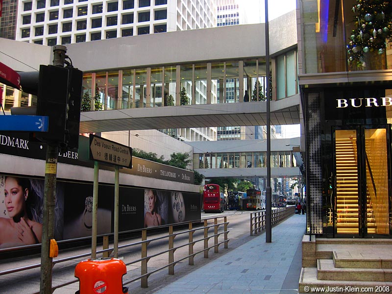 Typical Hong Kong bus stop: covered with billboards for diamonds and high fashion.