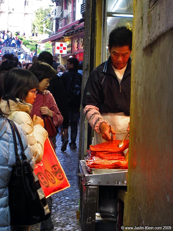 Selling thin cuts of beef in a very Chinese-feeling street market.