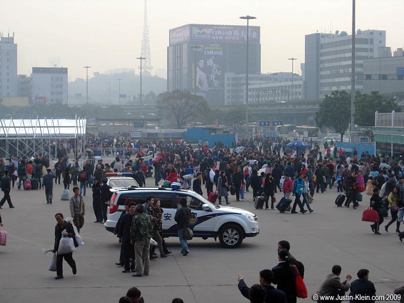 The overpopulated, overpolluted Guangzhou Train Station courtyard.