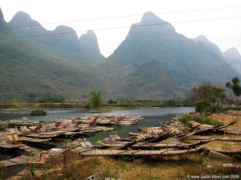 I mentioned in the previous post how many of Yangshuo's summer activities are unavailable in the winter. Here we find an army of bamboo rafts...eagerly awaiting next year's peak tourist crowd.