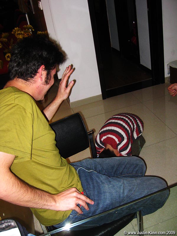 One very common tradition is for the children to kneel on the ground and bow to their elders, the response to which is usually the passing of an envelope full of cash. Here, Andy can be seen getting out his gift for Junior.