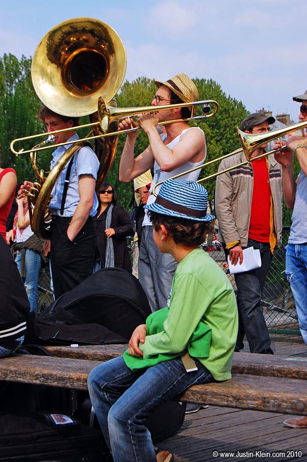 A boy watching some street performers at Ponte des Artes, Paris.