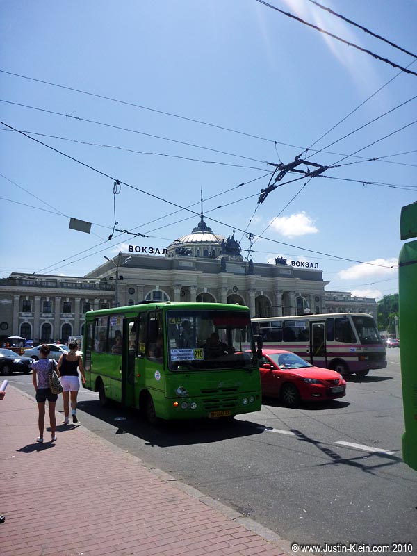 This looks like a potential bus station, right? Nope! It's just a place where dozens of buses happen to stop...right in front of the <i>train</i> station.