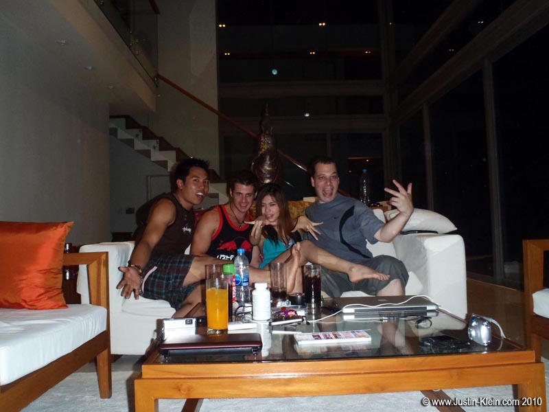 Herb, myself, Wan, and Kelly rushing to cram on the couch before the camera's timer fires.