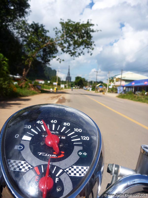 Making my way out of town on Noi's little scooter.