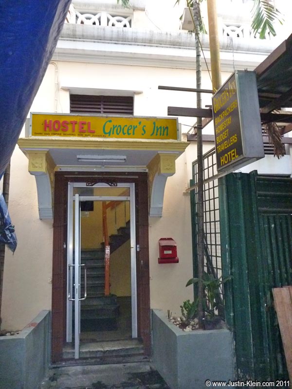 Grocer's Inn, KL. It had everything you could ever want: tiny shoebox-sized rooms, windows without screens, noisy single-speed fans, bedbugs, even a stall right outside with fart-smelling durians.