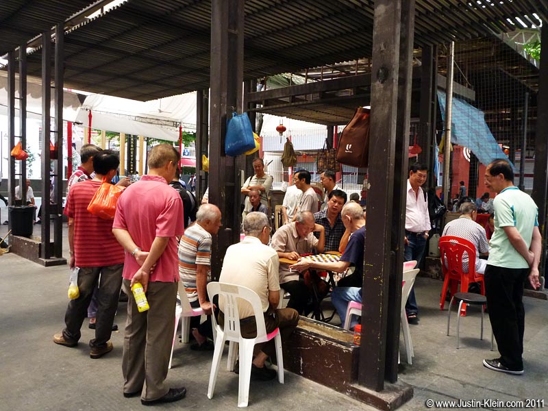 If a group of Chinese old men huddled around a checkerboard doesn't scream "Chinatown," I don't know what does.