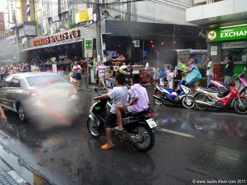 Remember how I said Thailand is lawless? Yeah, that's a pair of 9-year-olds riding a motorbike right through the city : P