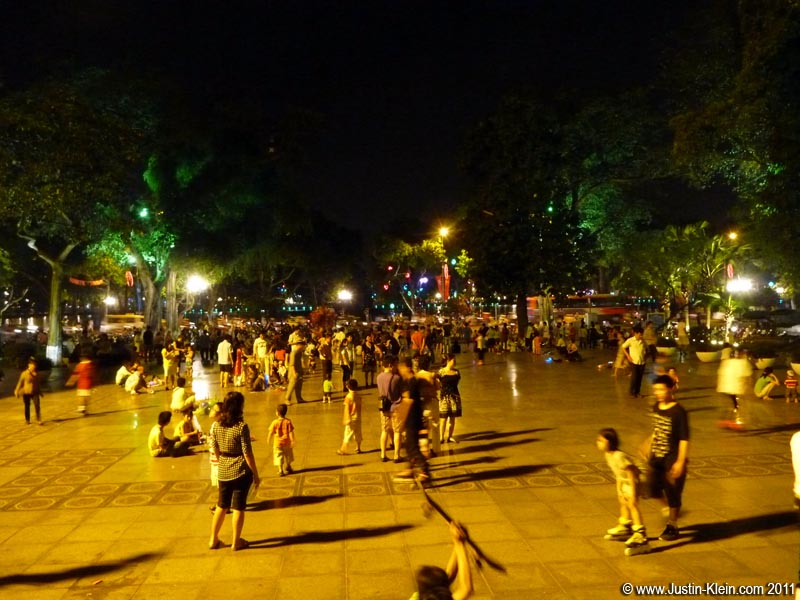 A bustling square next to Hoan Kiem Lake.