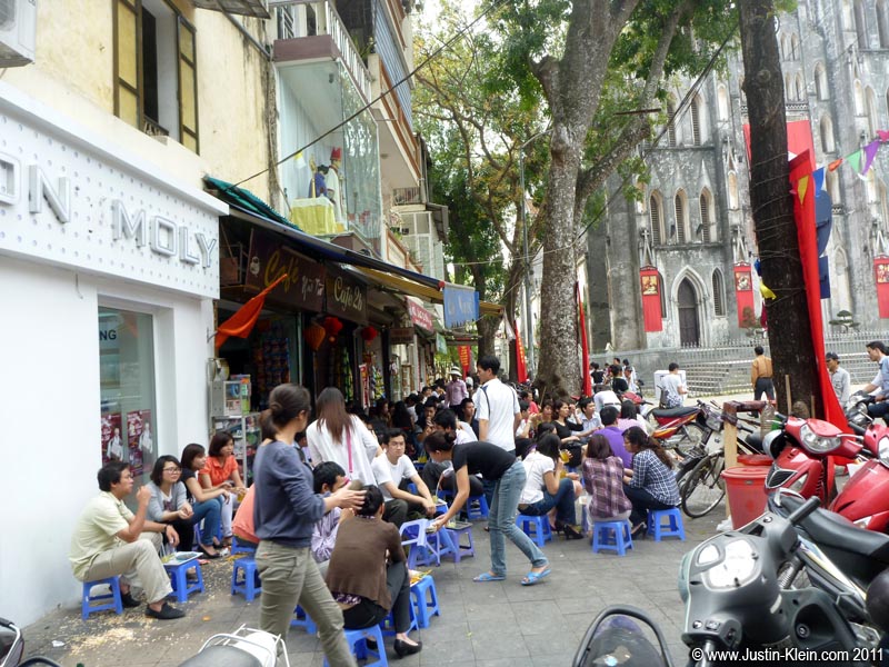 This isn't actually Bia Hoi Junction but the concept is the same: small stools by the side of the road where people sit, snack, talk, and drink.